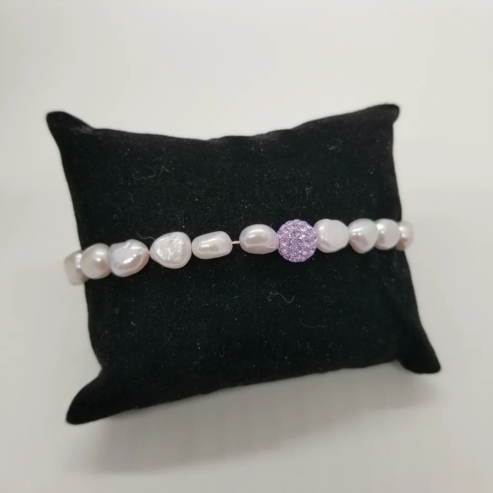 stretch pearl bracelet with purple sparkly ball bead